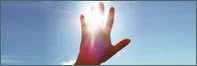 Hand held up to bright sunlight, back pain therapy